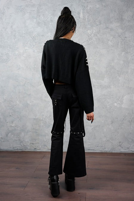 Schwarze Schlaghose Sienna Utility Flare Trousers mit abnehmbaren Beinen und vielen Details von Banned