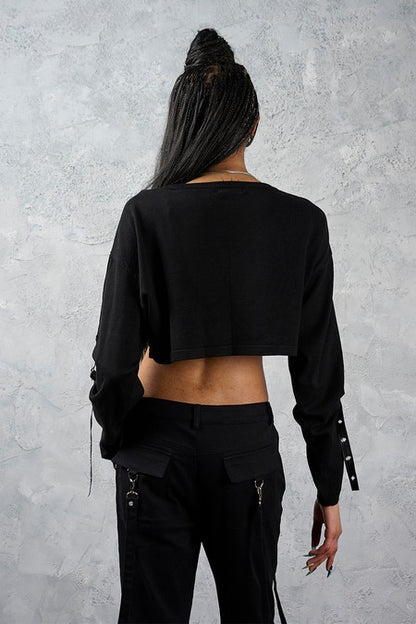 Schwarzer, bauchfreier Crossbound Crop Jumper mit Allover-Kreuzprint von Banned