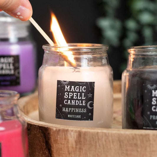 Glas mit weißer Kerze mit Aufkleber mit der Aufschrift 'Magic Spell Candle Happiness'