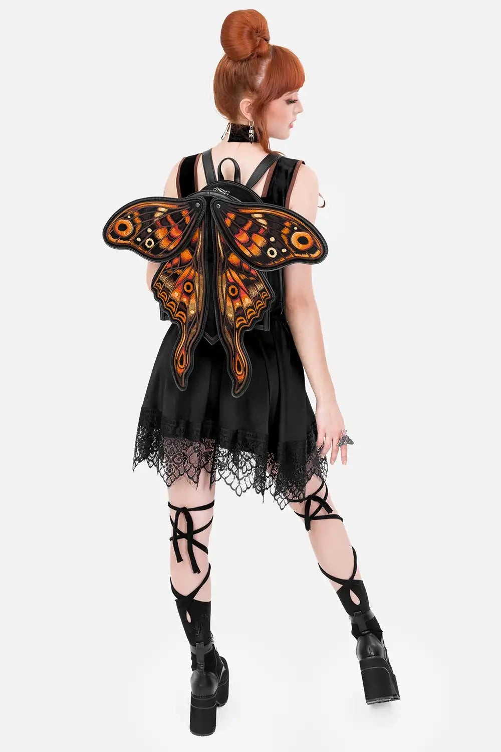 Schwarzer Rucksack IGNIS MOTH BACKPACK mit orangenen Mottenflügeln von Restyle