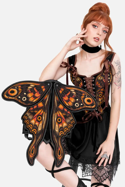 Schwarzer Rucksack IGNIS MOTH BACKPACK mit orangenen Mottenflügeln von Restyle