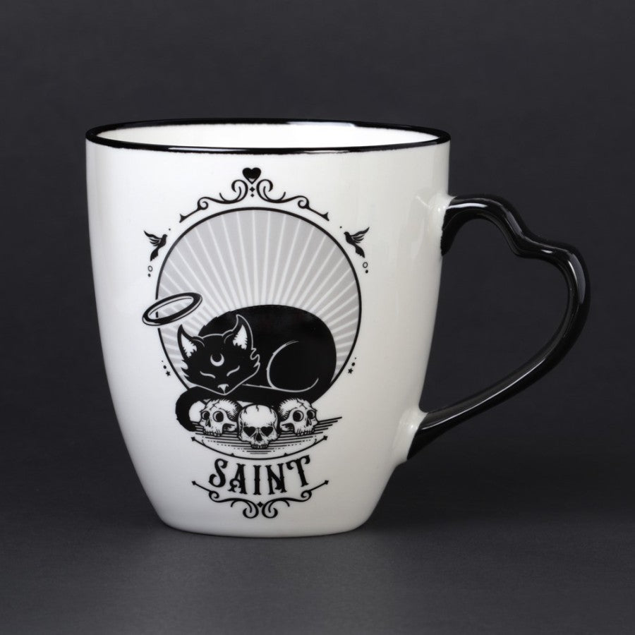 Weiße Tasse Saint/Sinner Cat Mug mit schwarzem Katzenprint und schwarzem Herzhenkel von Alchemy